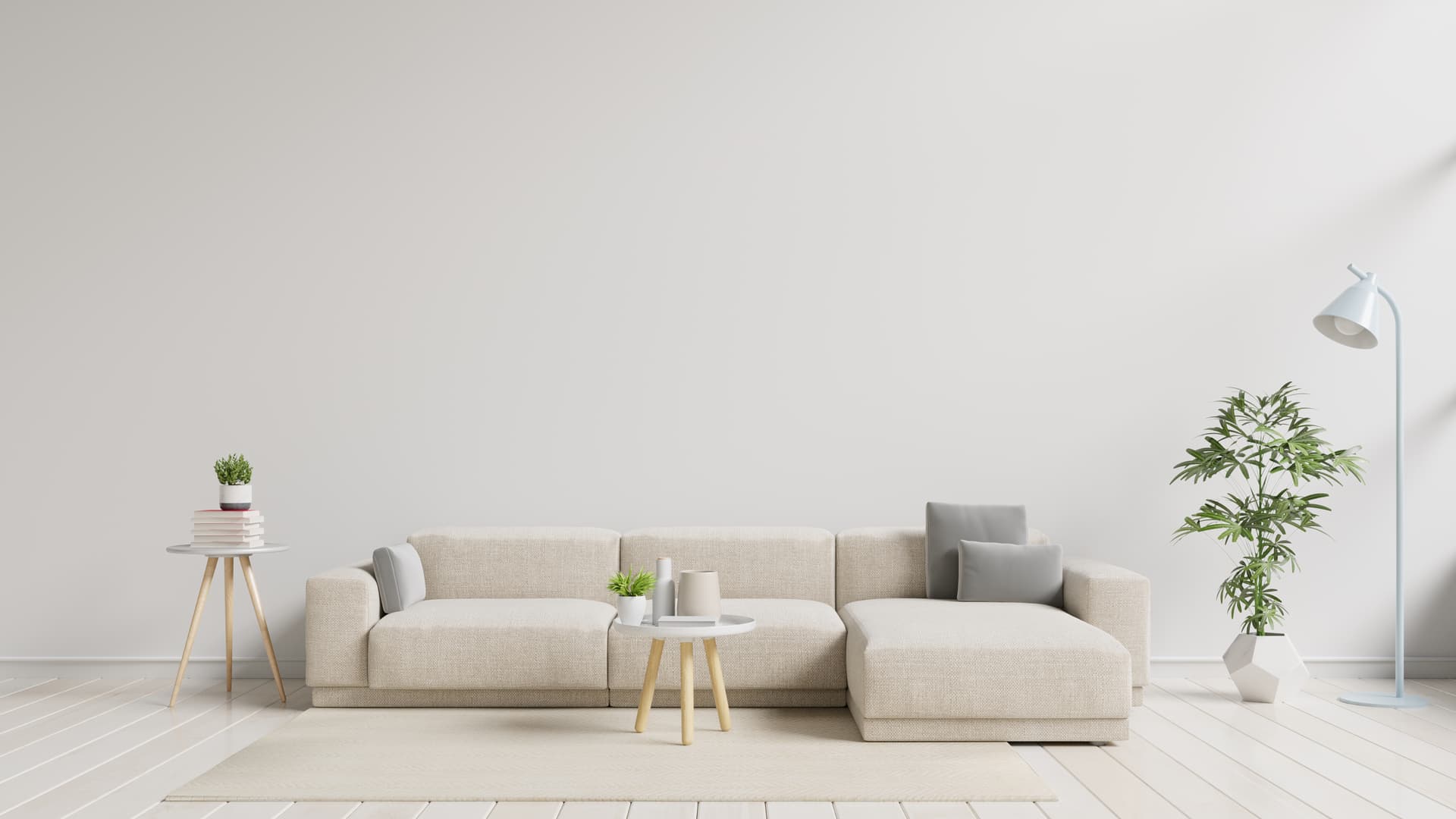 A calm neutral living room with a light sofa and timber side table